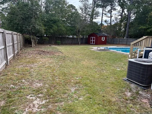 a view of a swimming pool with a patio
