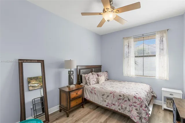 a bedroom with a bed and a mirror