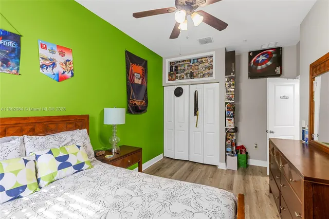 a bathroom with a sink mirror and toilet