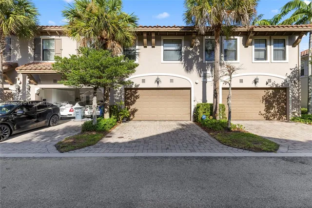 a living room with lots of furniture and a chandelier