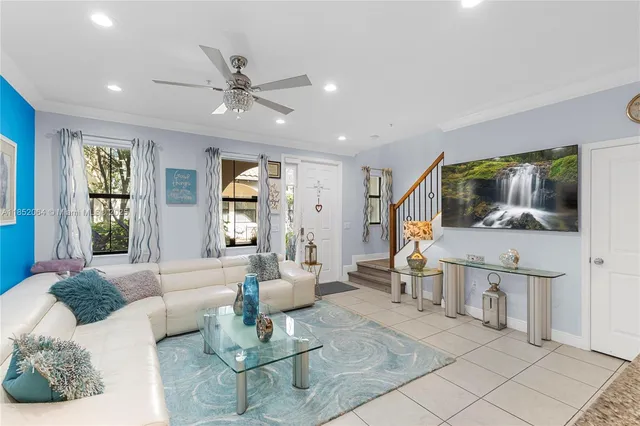 a kitchen with stainless steel appliances granite countertop a sink a stove counter space and a window
