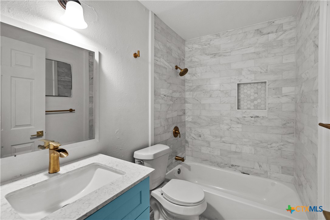 2213 Valley Forge Avenue Temple, TX 76504 - Photo 11 of 18 a bathroom with a sink toilet and shower