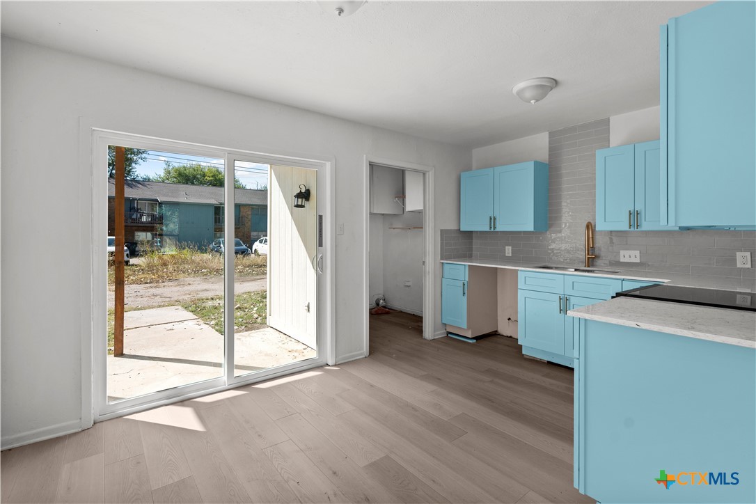 2213 Valley Forge Avenue Temple, TX 76504 - Photo 16 of 18 a kitchen with a cabinets and white appliances