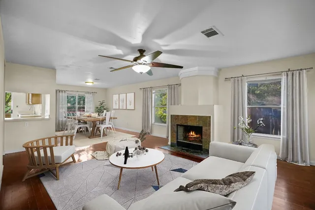 a living room with furniture and a fireplace