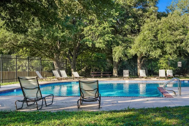 a view of a backyard with sitting area