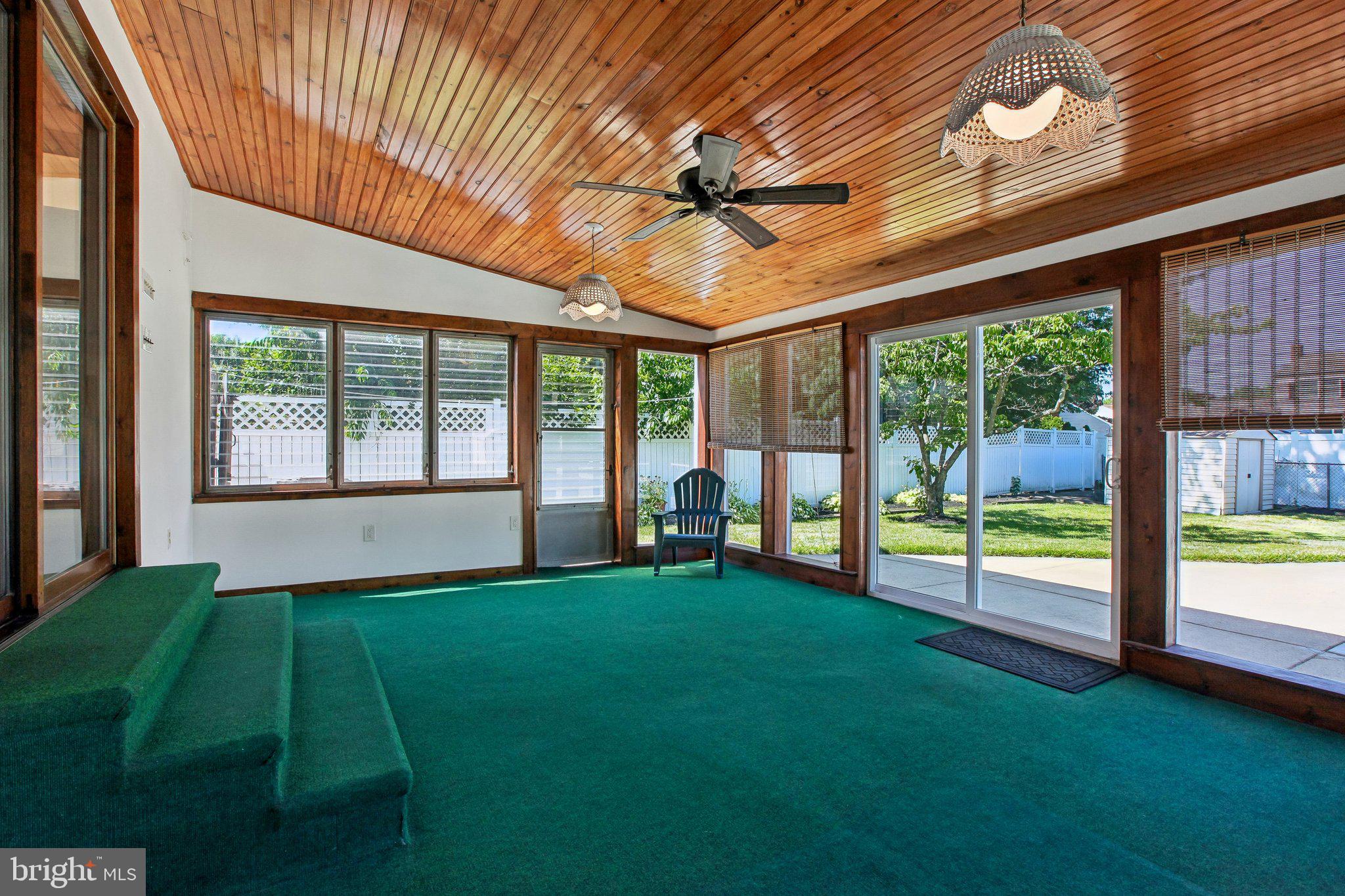 56 Whitehall Road Hamilton, NJ 08690 - Photo 21 of 37 Bright sunroom with wooden accents.