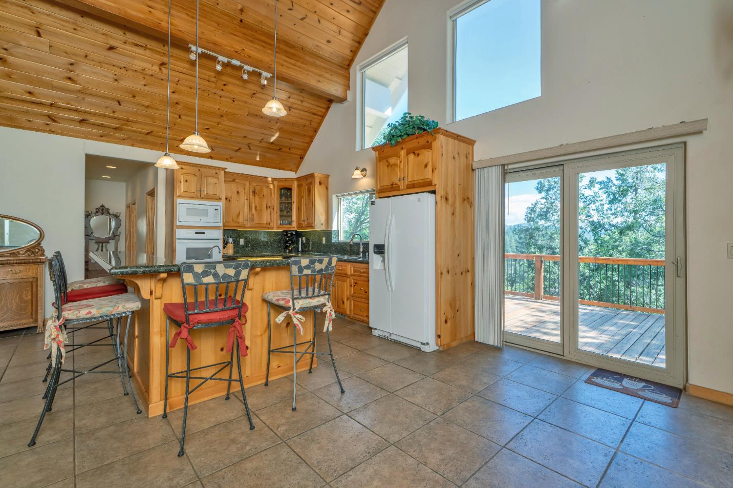 4117 Pearl Road Pollock Pines, CA 95726 - Photo 14 of 47 a dining room filled with furniture and a chandelier