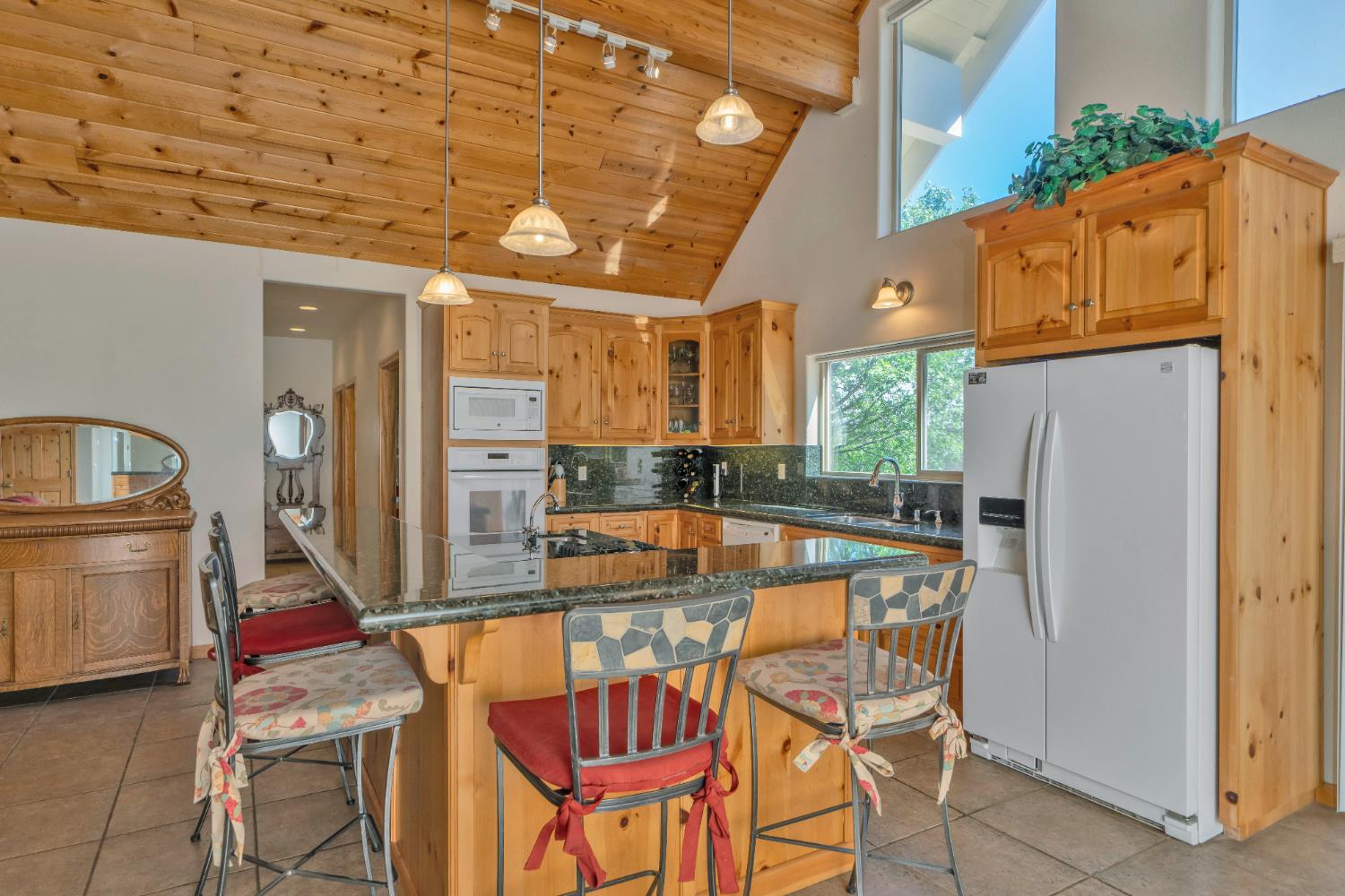 4117 Pearl Road Pollock Pines, CA 95726 - Photo 15 of 47 a dining hall with stainless steel appliances granite countertop a refrigerator and a stove