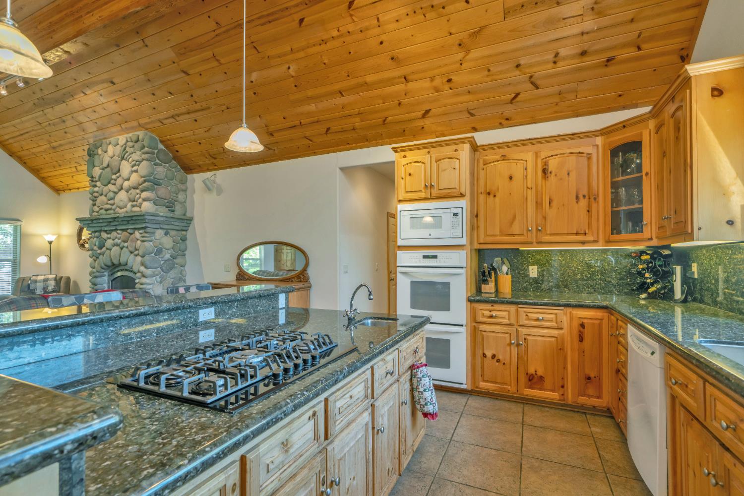 4117 Pearl Road Pollock Pines, CA 95726 - Photo 17 of 47 a kitchen with stainless steel appliances granite countertop a stove and a refrigerator