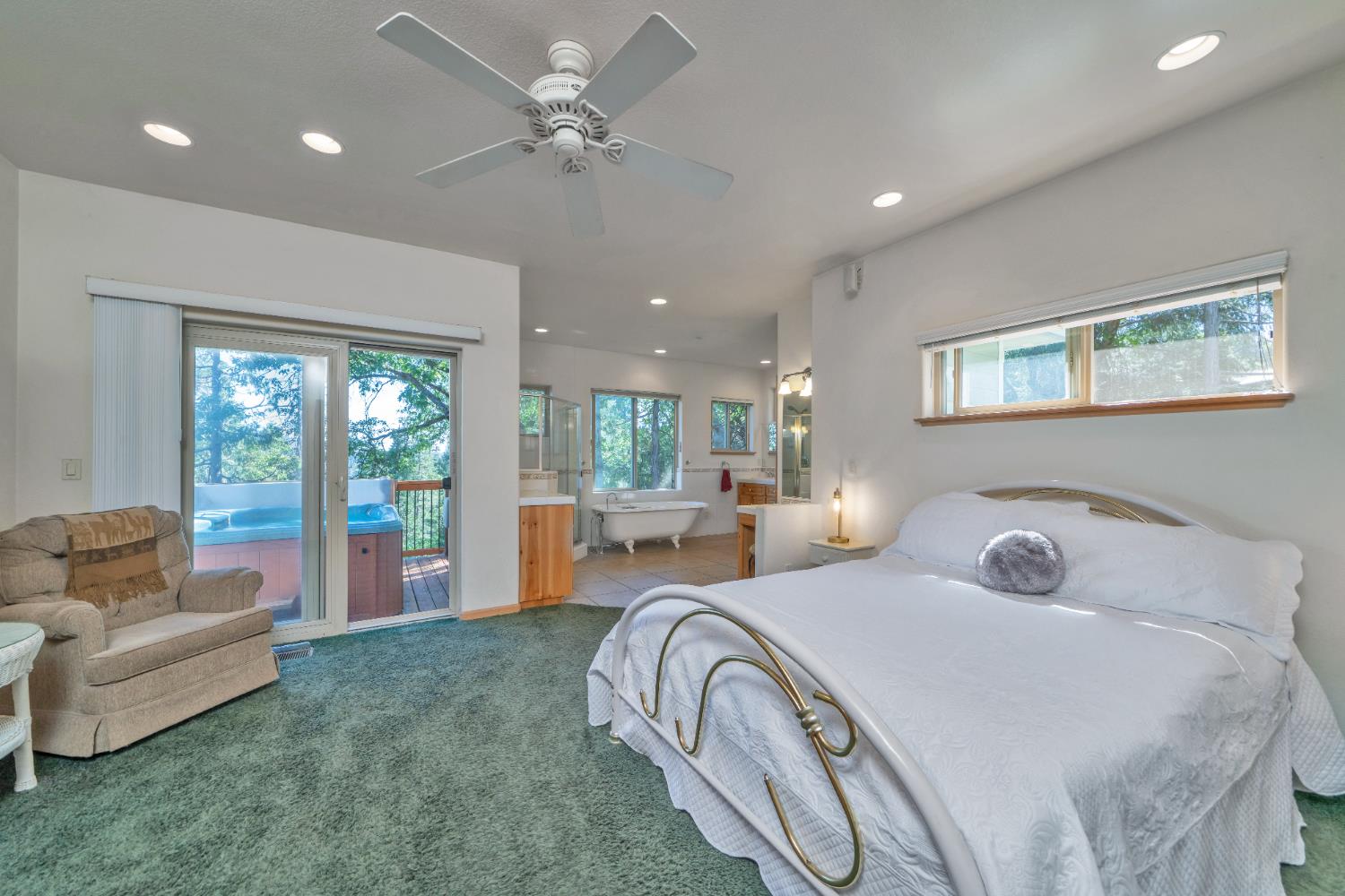 4117 Pearl Road Pollock Pines, CA 95726 - Photo 22 of 47 a bedroom with bed and a chandelier