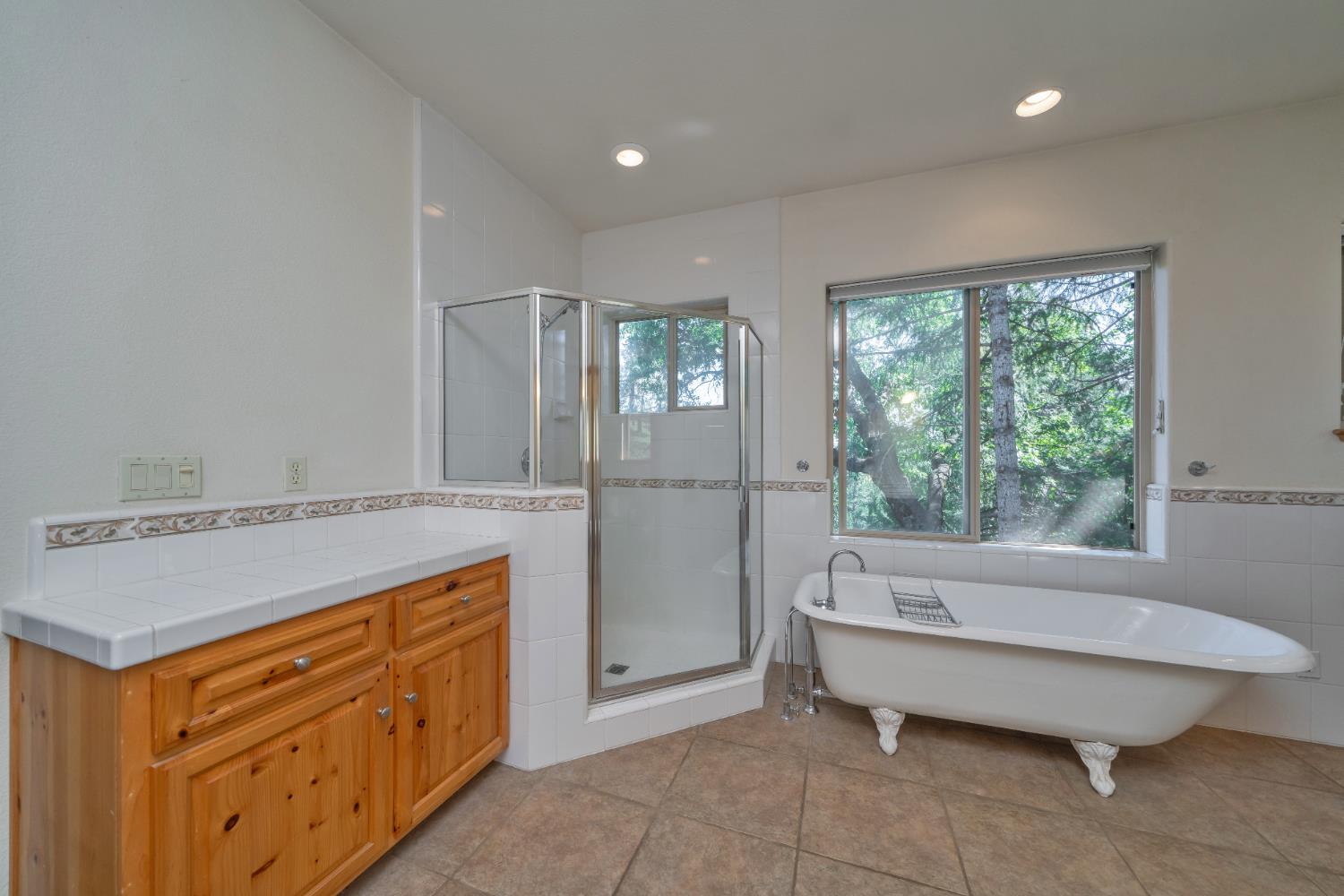 4117 Pearl Road Pollock Pines, CA 95726 - Photo 27 of 47 a bathroom with a tub sink and mirror