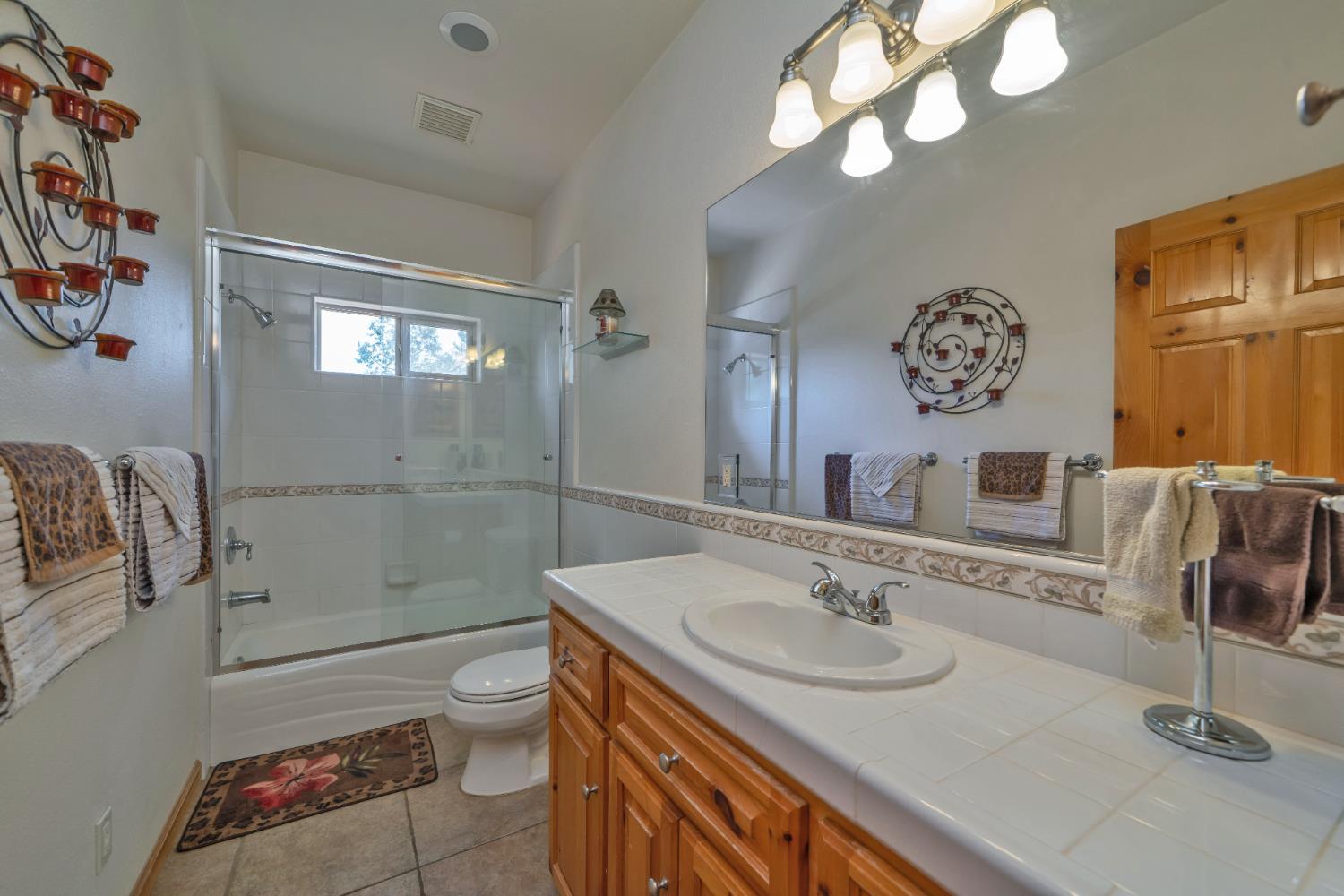 4117 Pearl Road Pollock Pines, CA 95726 - Photo 33 of 47 a bathroom with a sink a toilet and shower
