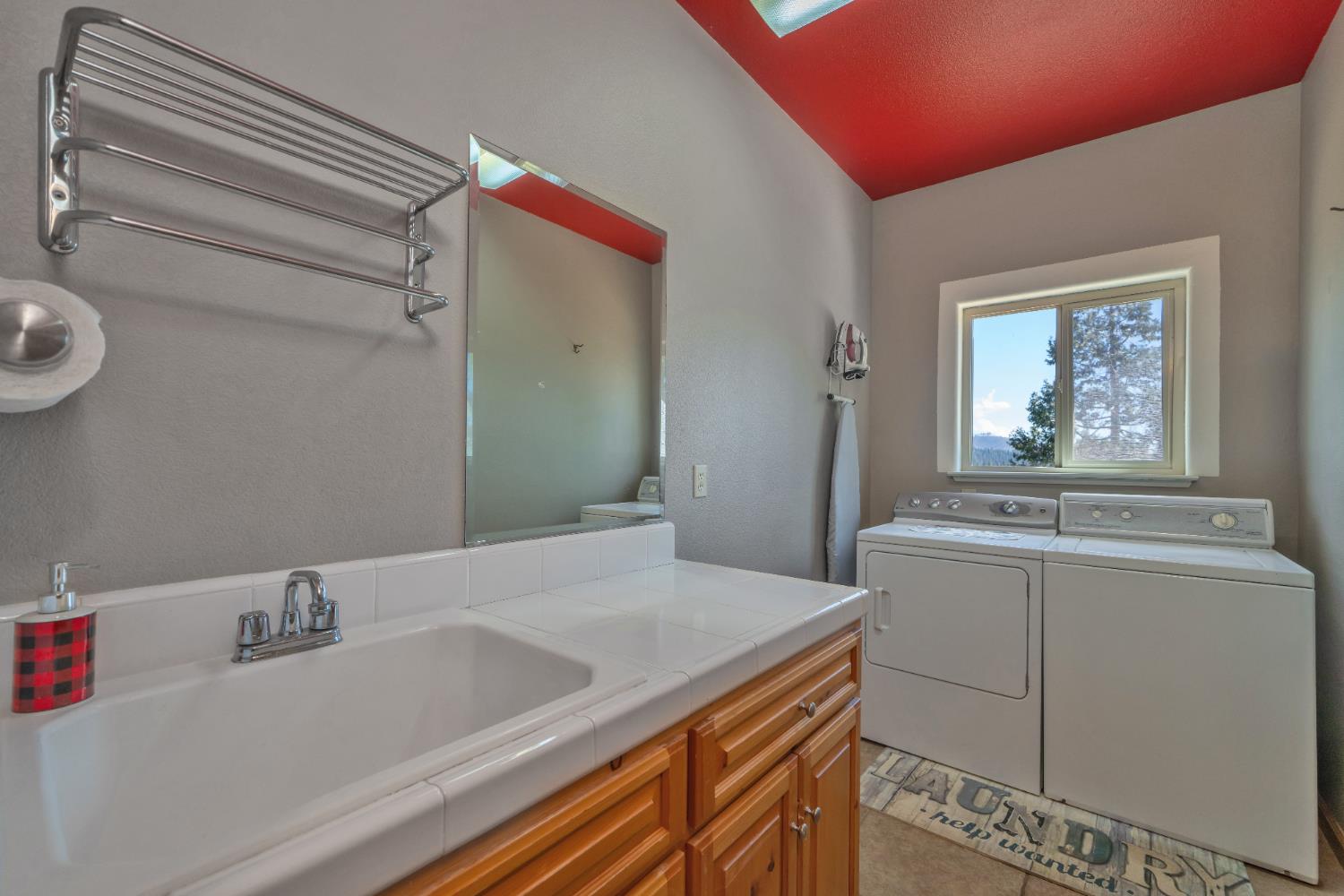 4117 Pearl Road Pollock Pines, CA 95726 - Photo 36 of 47 a bathroom with a sink and a mirror
