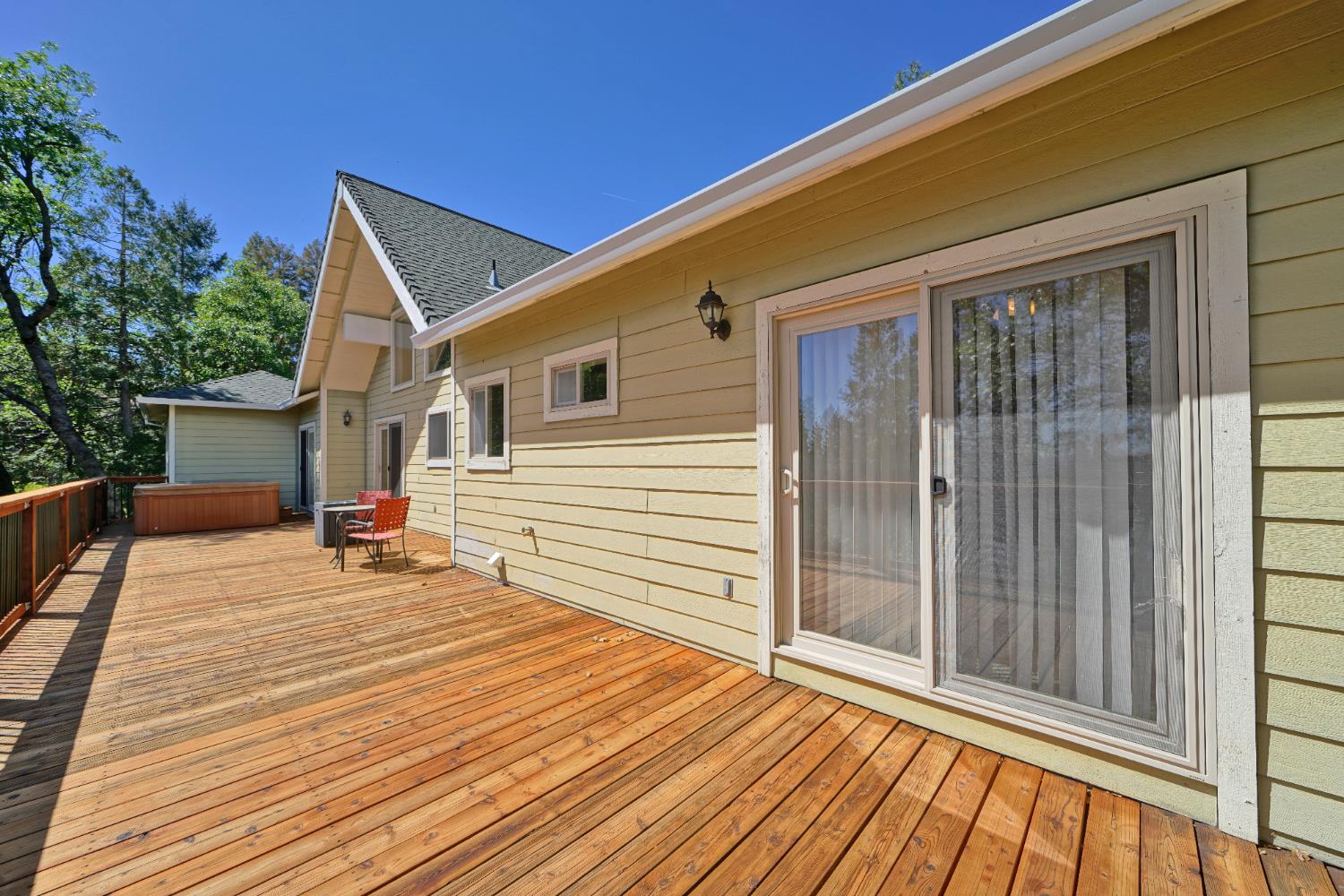 4117 Pearl Road Pollock Pines, CA 95726 - Photo 37 of 47 a view of a house with wooden deck and furniture