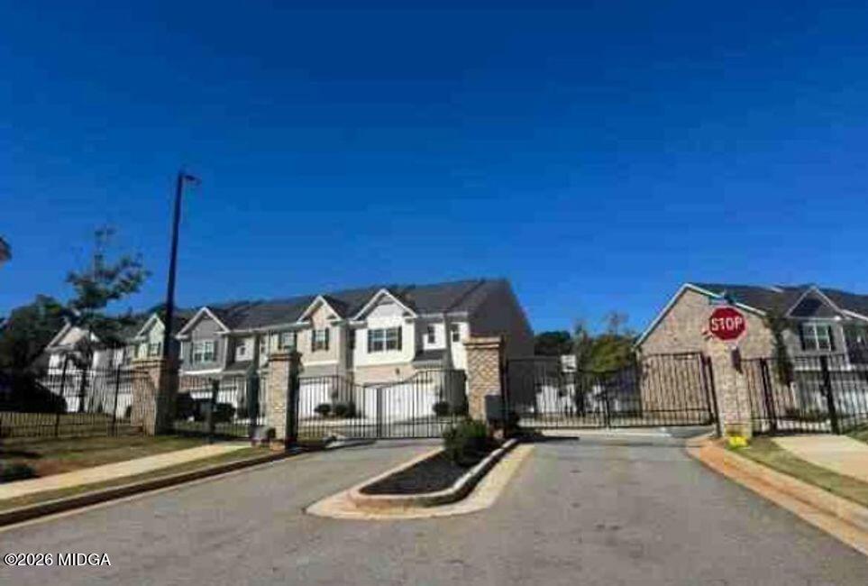 168 Hampton Street McDonough, GA 30253 - Photo 1 of 2 a view of a street with cars on road