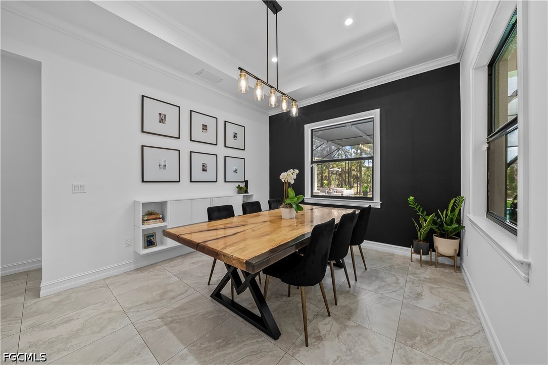 4498 8th Street Northeast Naples, FL 34120 - Photo 13 of 49 a dining room with furniture and window