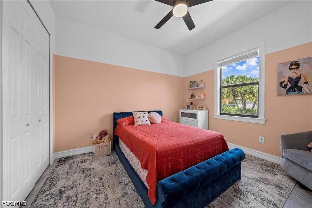 4498 8th Street Northeast Naples, FL 34120 - Photo 18 of 49 a bedroom with a bed and window