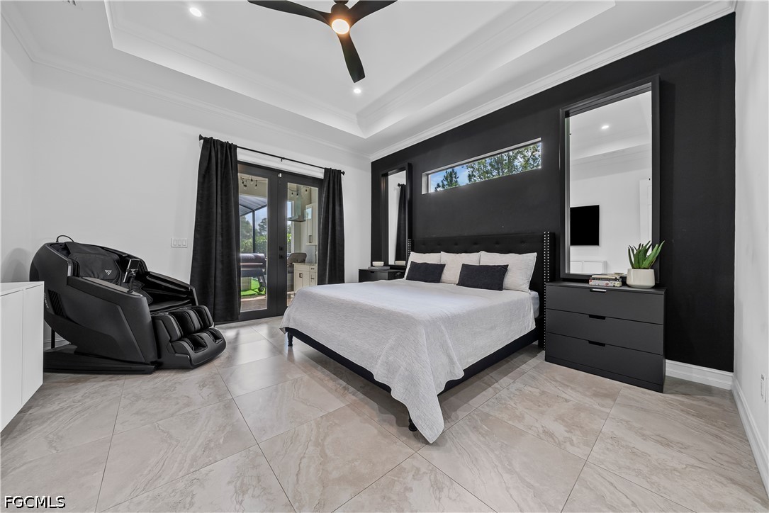 4498 8th Street Northeast Naples, FL 34120 - Photo 19 of 49 a bedroom with a bed and wooden floor