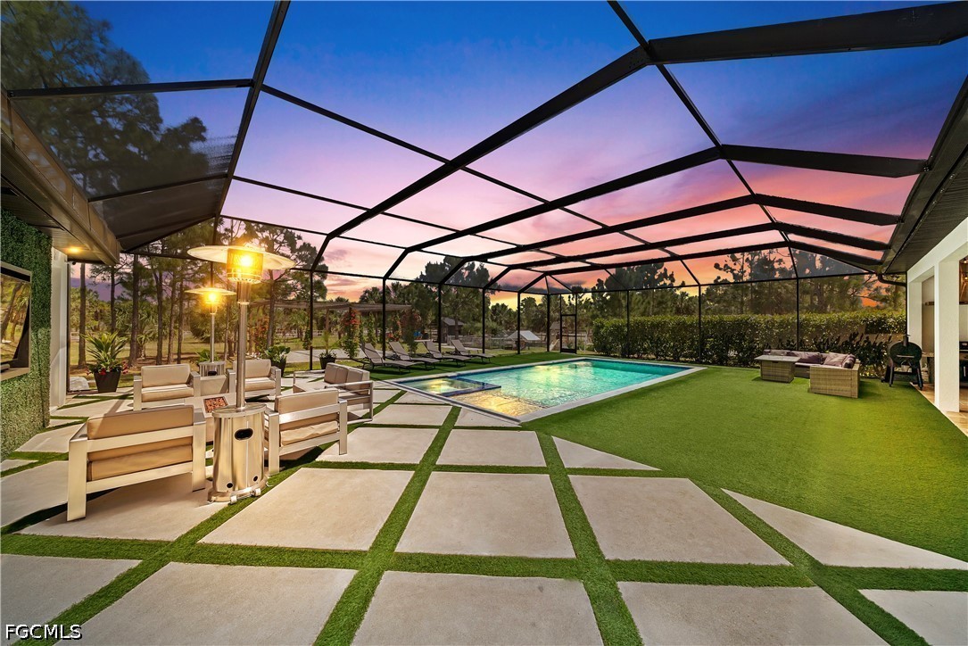 4498 8th Street Northeast Naples, FL 34120 - Photo 2 of 49 a view of a swimming pool with a patio