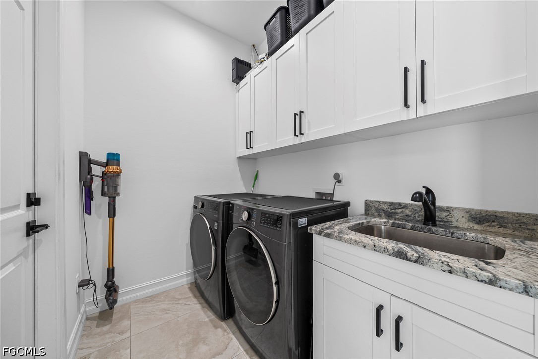 4498 8th Street Northeast Naples, FL 34120 - Photo 23 of 49 a utility room with dryer and washer