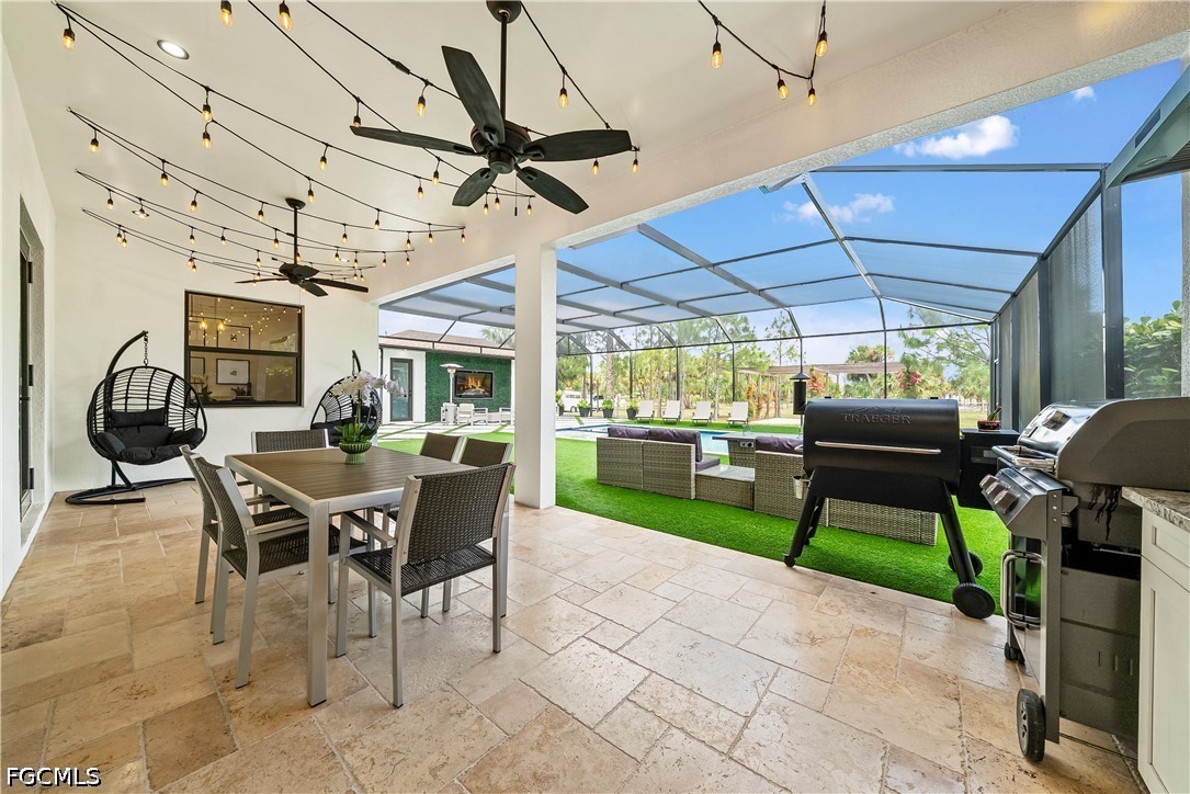 4498 8th Street Northeast Naples, FL 34120 - Photo 24 of 49 a view of a patio with a table and chairs