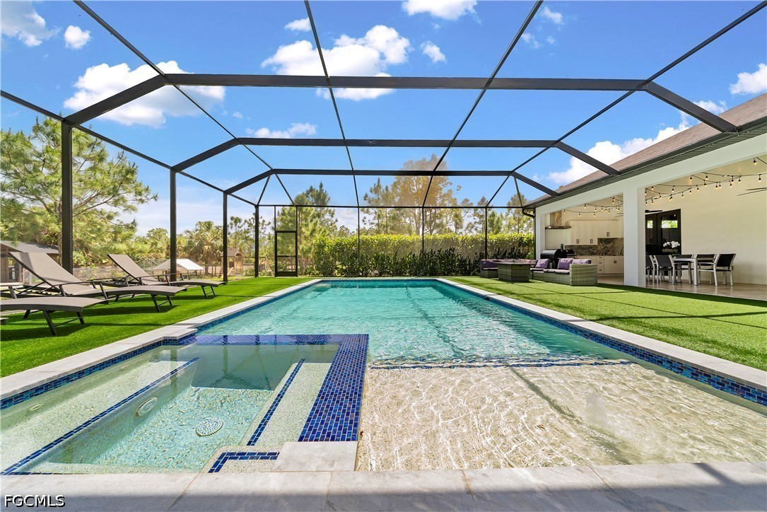 4498 8th Street Northeast Naples, FL 34120 - Photo 29 of 49 a view of a backyard with sitting area