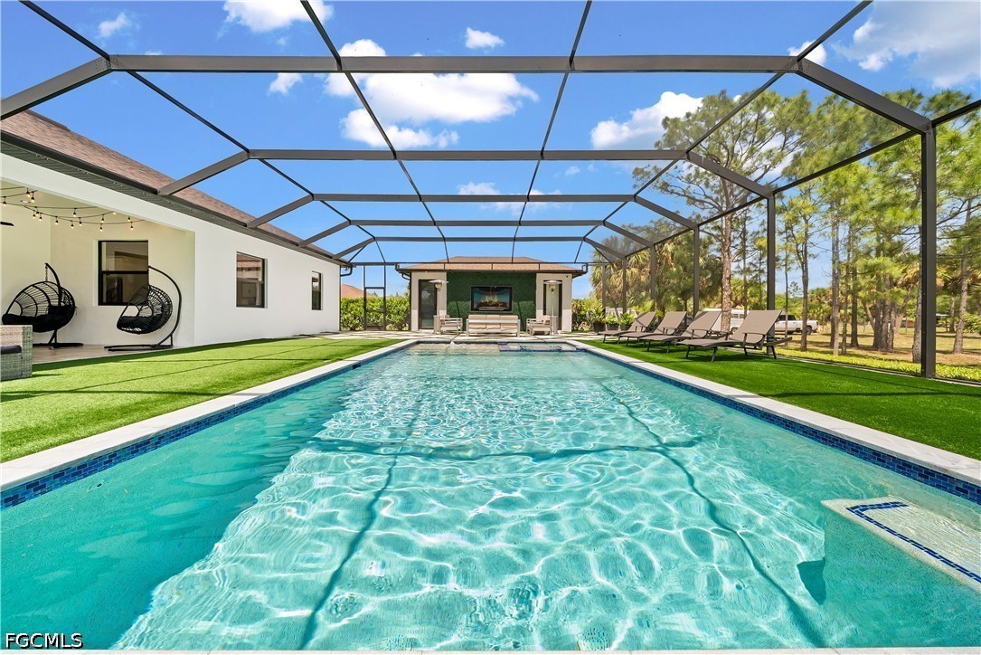 4498 8th Street Northeast Naples, FL 34120 - Photo 30 of 49 a front view of a house with a yard