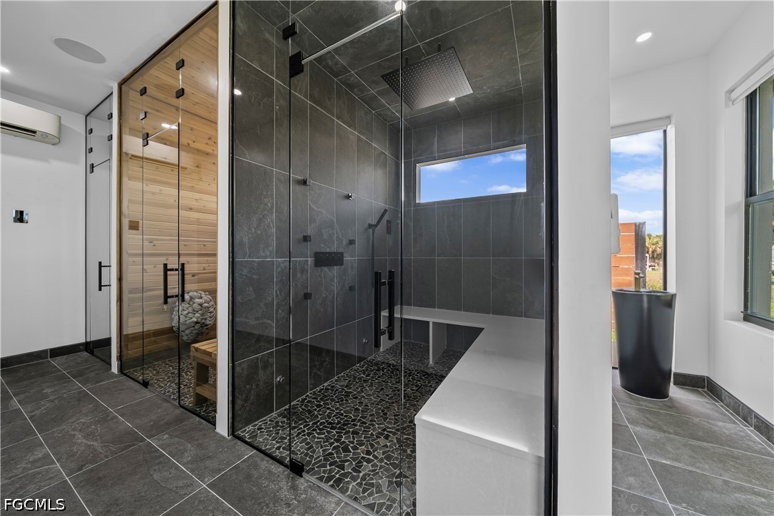 4498 8th Street Northeast Naples, FL 34120 - Photo 31 of 49 a bathroom with a shower and a sink