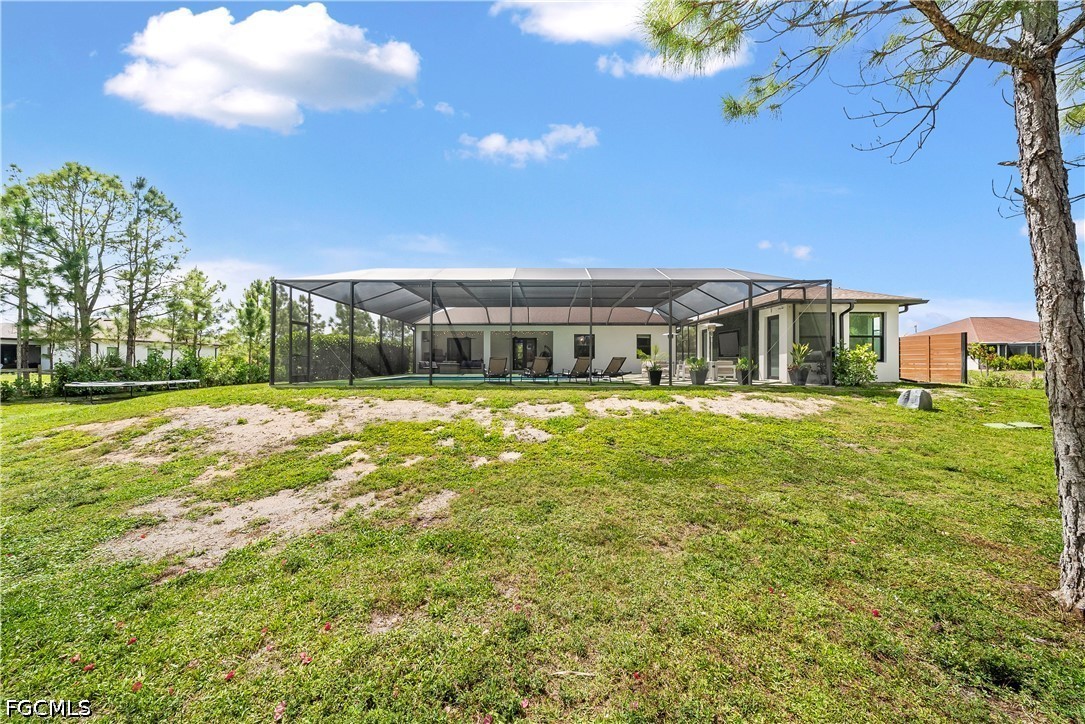 4498 8th Street Northeast Naples, FL 34120 - Photo 32 of 49 a front view of house with yard