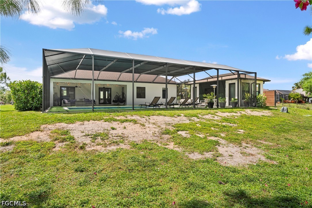 4498 8th Street Northeast Naples, FL 34120 - Photo 33 of 49 a view of a building with a big yard