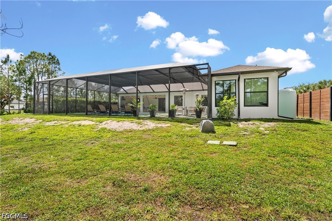 4498 8th Street Northeast Naples, FL 34120 - Photo 34 of 49 a view of a house with a swimming pool