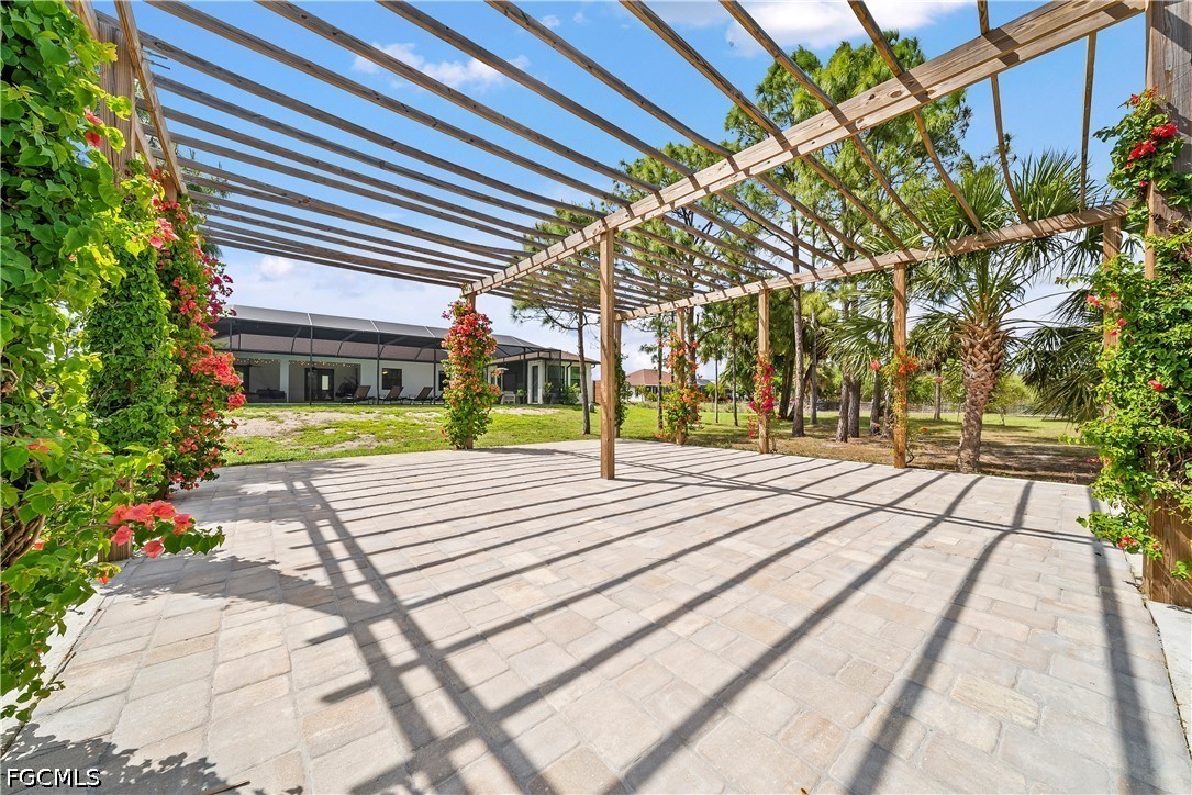 4498 8th Street Northeast Naples, FL 34120 - Photo 35 of 49 a view of a building with a garden