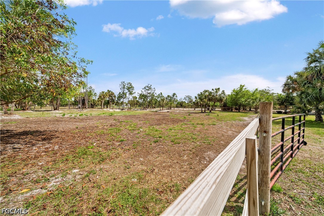 4498 8th Street Northeast Naples, FL 34120 - Photo 38 of 49 a view of a lake with a yard