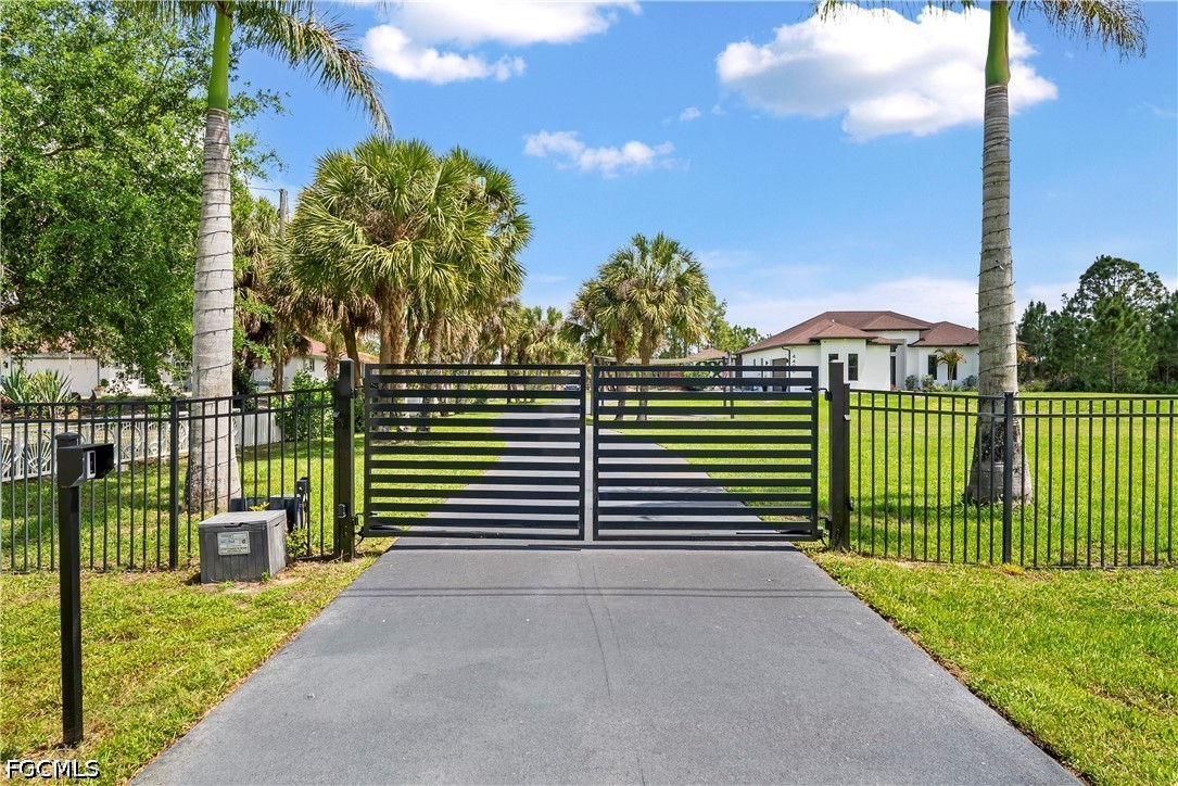 4498 8th Street Northeast Naples, FL 34120 - Photo 47 of 49 a view of a house with a street view and a yard