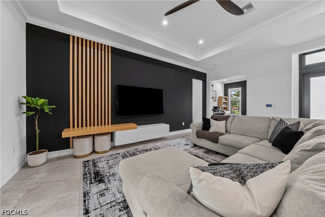 4498 8th Street Northeast Naples, FL 34120 - Photo 6 of 49 a living room with furniture and a flat screen tv