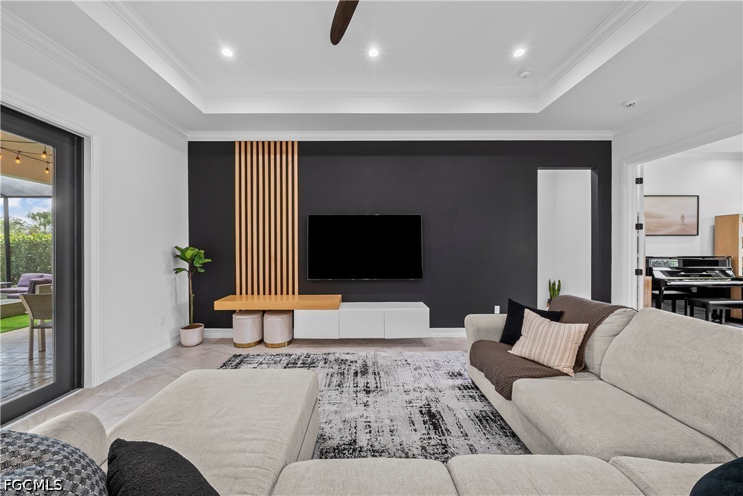 4498 8th Street Northeast Naples, FL 34120 - Photo 9 of 49 a living room with furniture and a flat screen tv