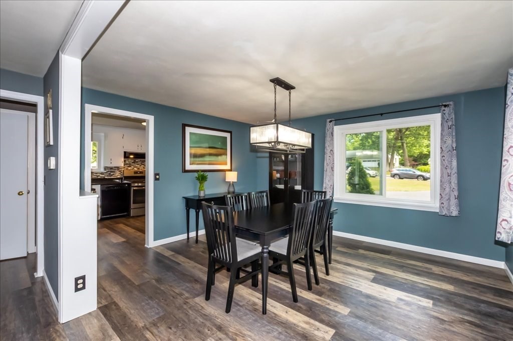 76 Woodland Road Longmeadow, MA 01106 - Photo 11 of 42 a view of a dining room with furniture window and wooden floor