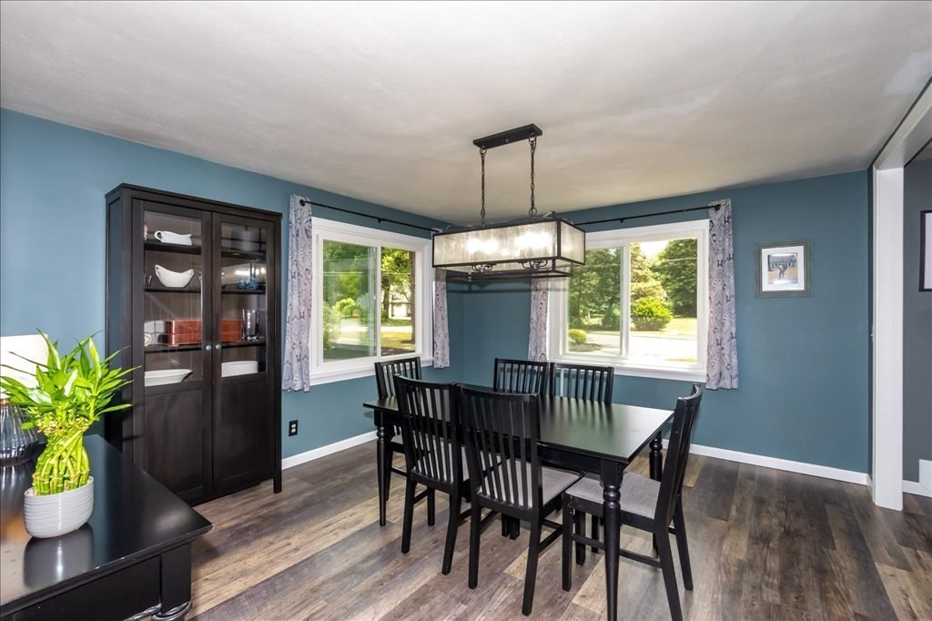 76 Woodland Road Longmeadow, MA 01106 - Photo 12 of 42 a view of a dining room with furniture window and wooden floor