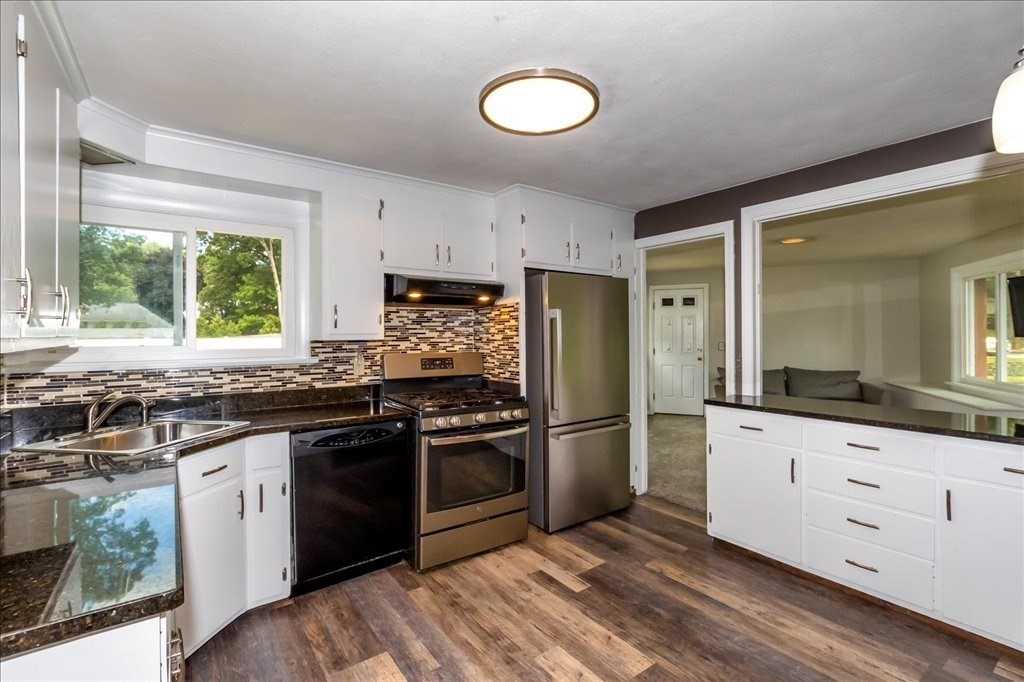 76 Woodland Road Longmeadow, MA 01106 - Photo 14 of 42 a kitchen with granite countertop a stove sink and refrigerator