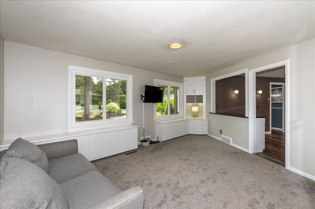 76 Woodland Road Longmeadow, MA 01106 - Photo 18 of 42 a living room with furniture and a flat screen tv