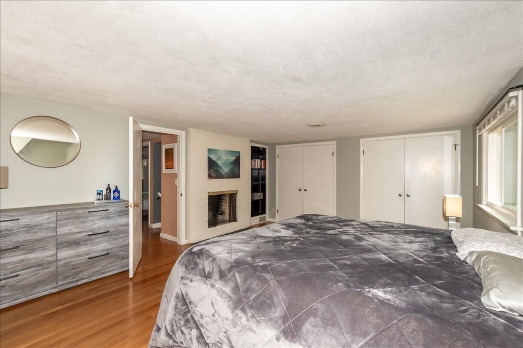 76 Woodland Road Longmeadow, MA 01106 - Photo 26 of 42 a spacious bedroom with a large bed and a dresser