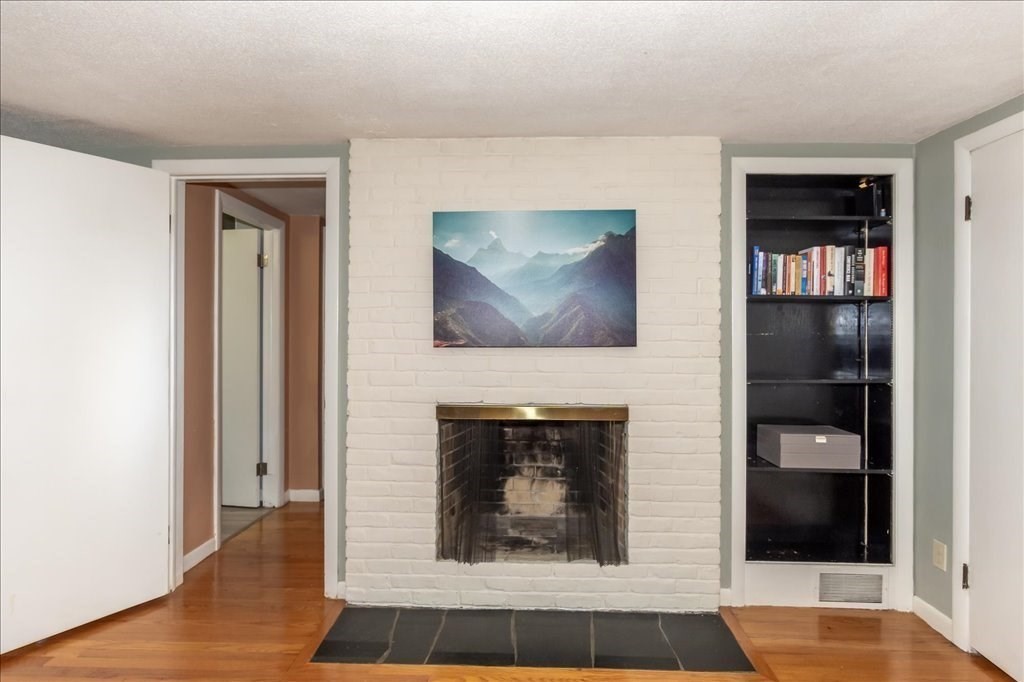 76 Woodland Road Longmeadow, MA 01106 - Photo 27 of 42 a living room with furniture and a fireplace