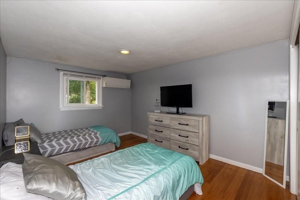 76 Woodland Road Longmeadow, MA 01106 - Photo 29 of 42 a bedroom with a bed and a television
