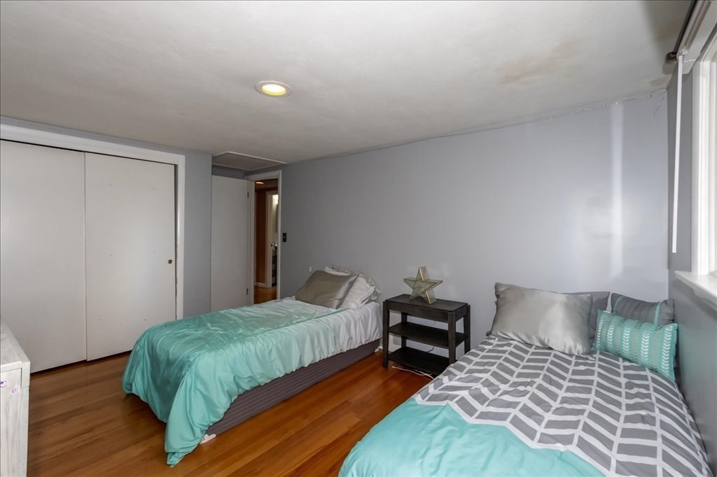 76 Woodland Road Longmeadow, MA 01106 - Photo 30 of 42 a bedroom with a bed and wooden floor