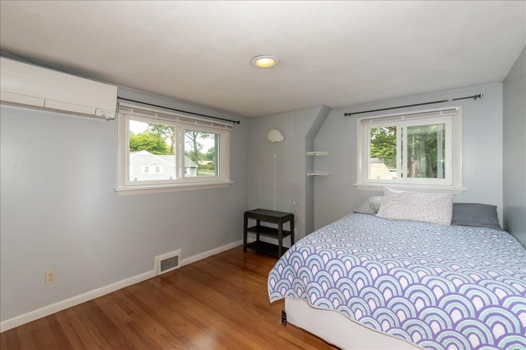 76 Woodland Road Longmeadow, MA 01106 - Photo 31 of 42 a bedroom with a bed and wooden floor