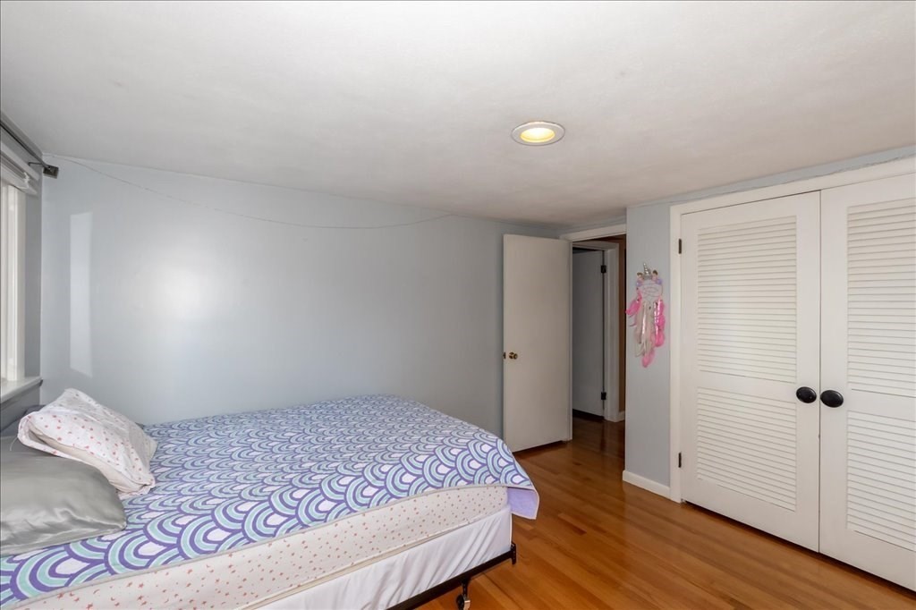 76 Woodland Road Longmeadow, MA 01106 - Photo 32 of 42 a bedroom with a bed and wooden floor