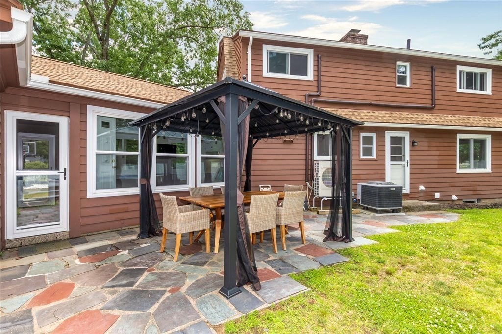 76 Woodland Road Longmeadow, MA 01106 - Photo 36 of 42 a view of a house with a patio