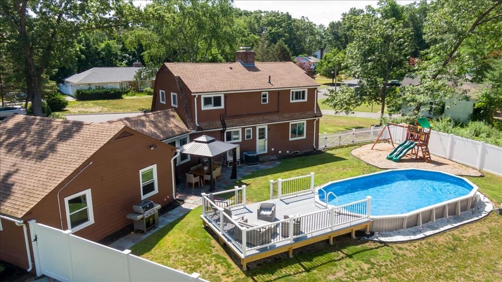 76 Woodland Road Longmeadow, MA 01106 - Photo 42 of 42 an aerial view of a house with swimming pool and large trees