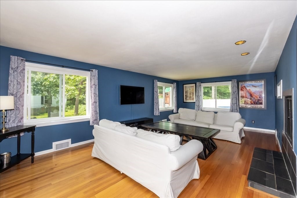 76 Woodland Road Longmeadow, MA 01106 - Photo 8 of 42 a living room with furniture and a flat screen tv