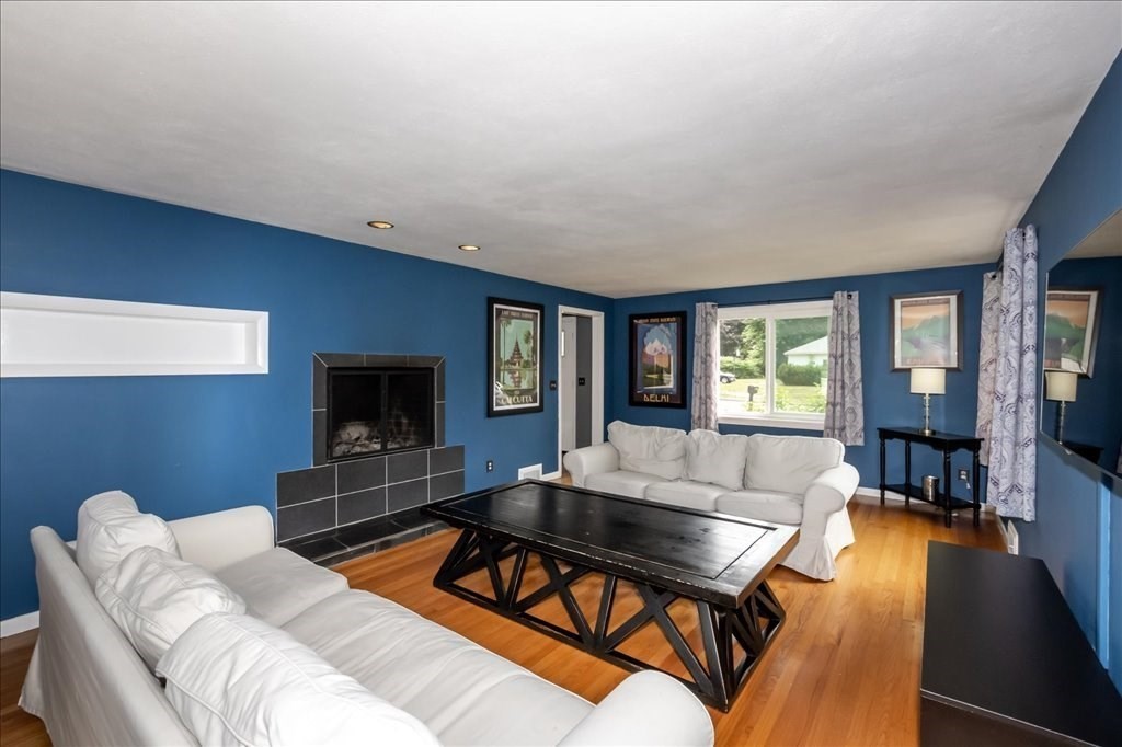 76 Woodland Road Longmeadow, MA 01106 - Photo 9 of 42 a living room with furniture and a flat screen tv